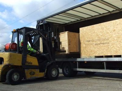 forklift and crates in yard Road freight